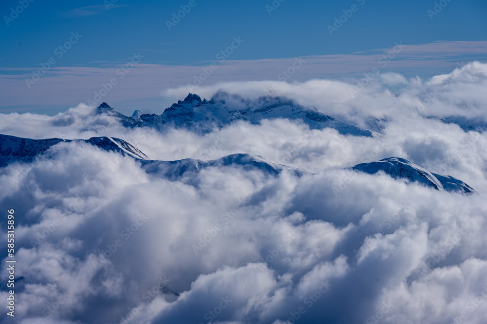 A sea of clouds with mountains peaks standing out, Swiss Alps, Valais A sea of clouds with mountains peaks standing out, Swiss Alps, Valais