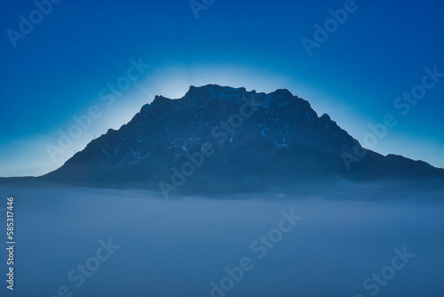 Glowing Zugspitze on misty morning