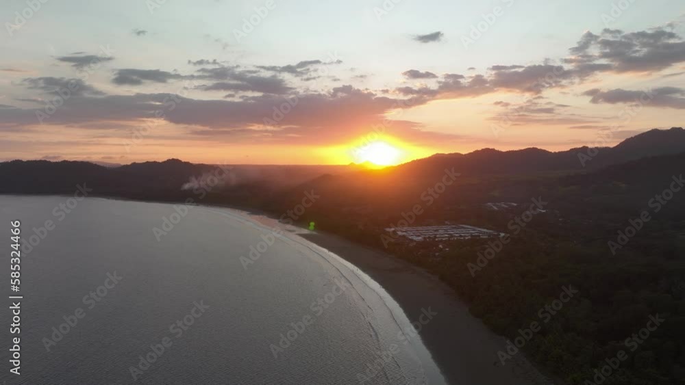 The sky turns into a canvas of warm hues as the sun emerges from the horizon, casting a golden trail on the rippling waves of the ocean. The sky turns into a canvas of warm hues as the sun emerges from the horizon, casting a golden trail on the rippling waves of the ocean.