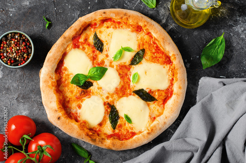 Italian Pizza Margherita with Mozzarella Cheese and Basil Leaves on Dark Background, Freshly Baked Pizza
