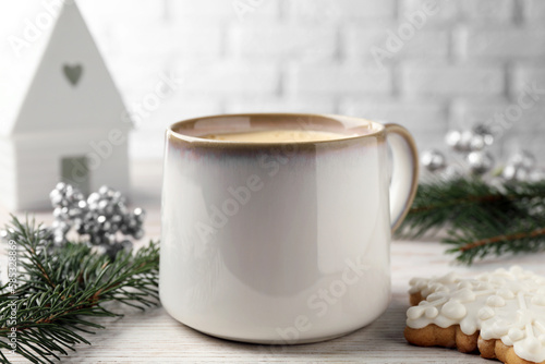 Wallpaper Mural Cup of delicious eggnog, fir branch and cookie on wooden table, closeup Torontodigital.ca