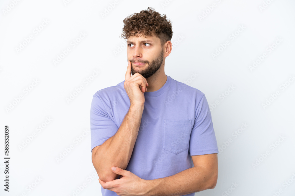 Young handsome caucasian man isolated on white background having doubts and thinking Young handsome caucasian man isolated on white background having doubts and thinking