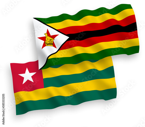 Flags of Togolese Republic and Zimbabwe on a white background
