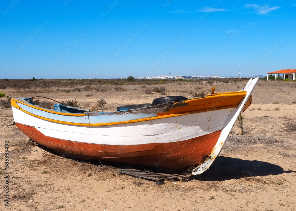 Wooden fisher boat on a beach