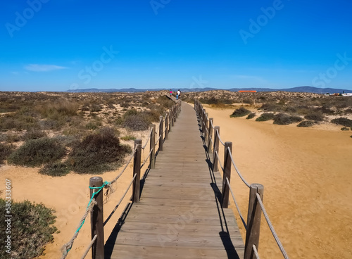 Hiking across the beautiful island of Culatra at the Algarve coast of Portugal photo