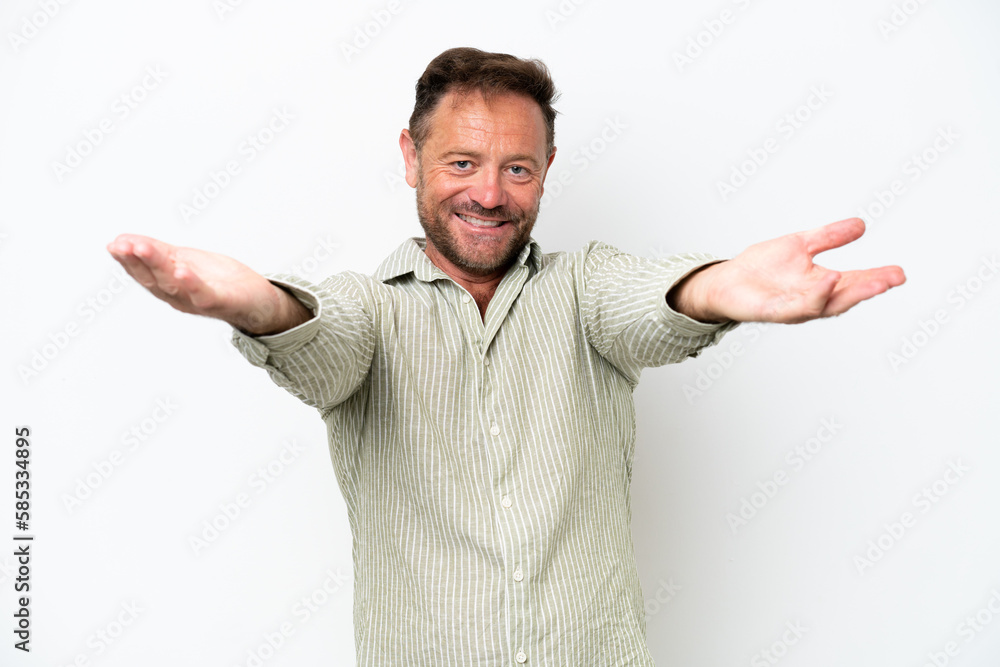 Fototapeta premium Middle age caucasian man isolated on white background presenting and inviting to come with hand