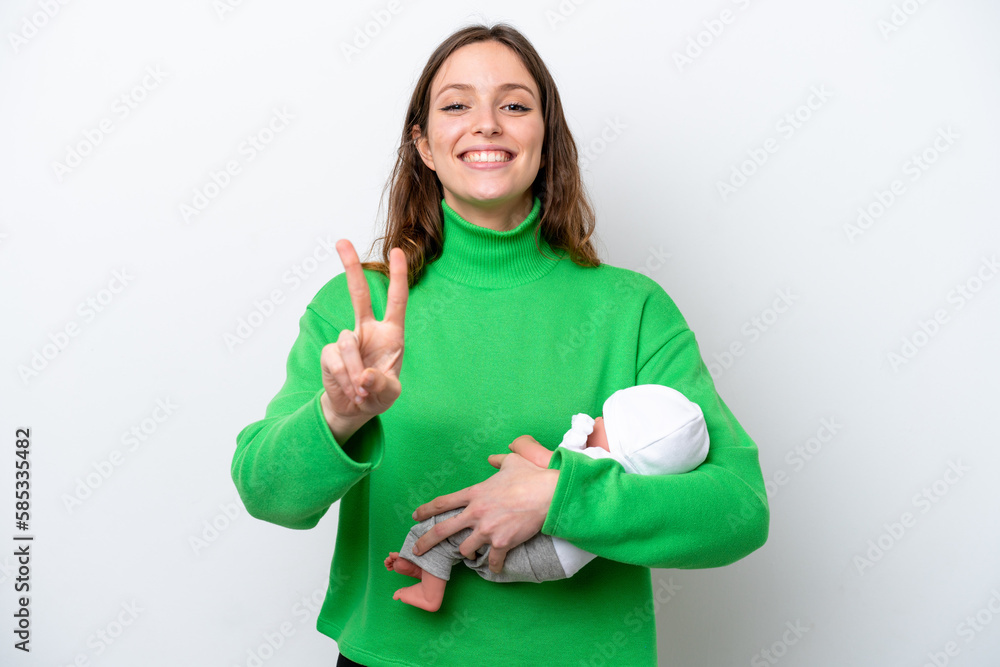 Young caucasian woman with her cute baby isolated on white background smiling and showing victory sign Young caucasian woman with her cute baby isolated on white background smiling and showing victory sign