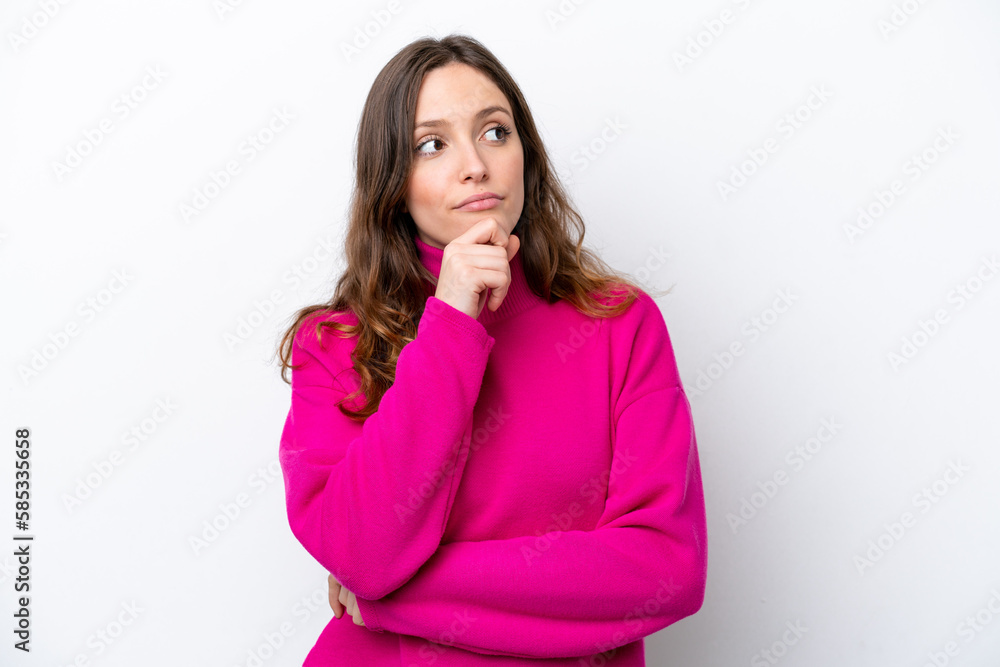 Young caucasian woman isolated on white background and looking up Young caucasian woman isolated on white background and looking up