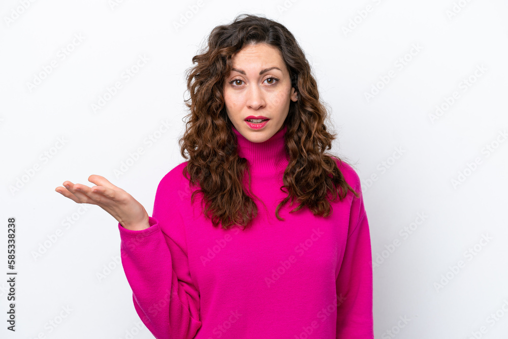 Young caucasian woman isolated on white background making doubts gesture Young caucasian woman isolated on white background making doubts gesture