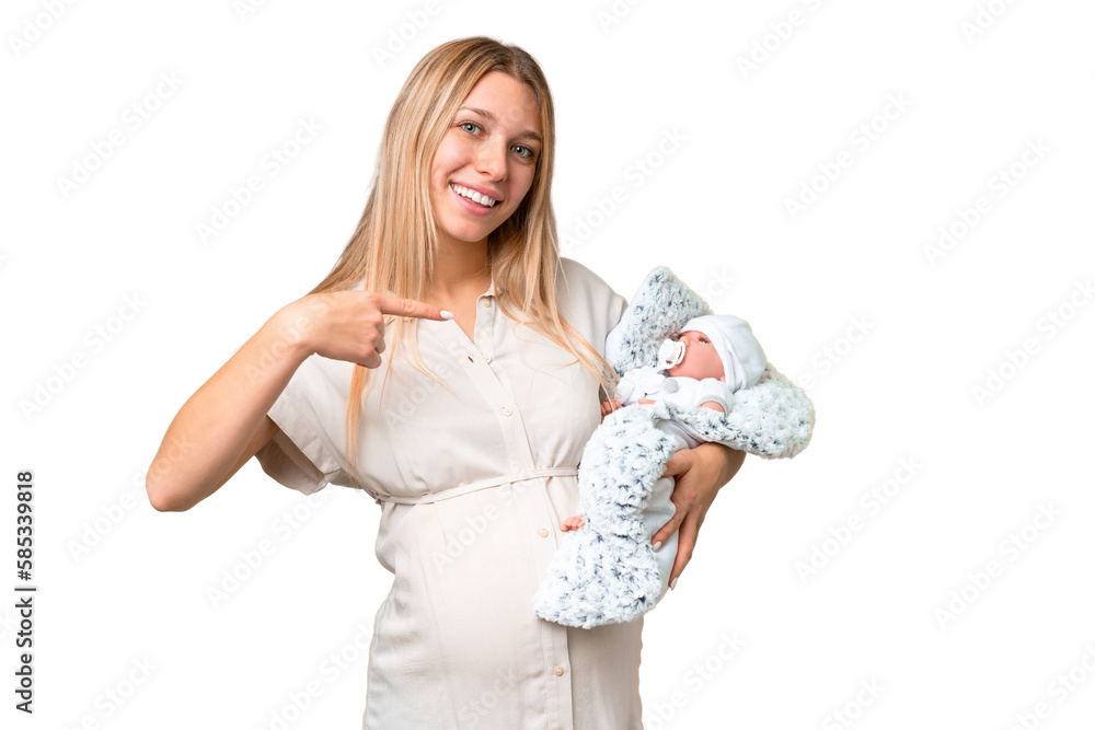 Young pretty pregnant woman with her newborn baby over isolated chroma key background and pointing it Young pretty pregnant woman with her newborn baby over isolated chroma key background and pointing it