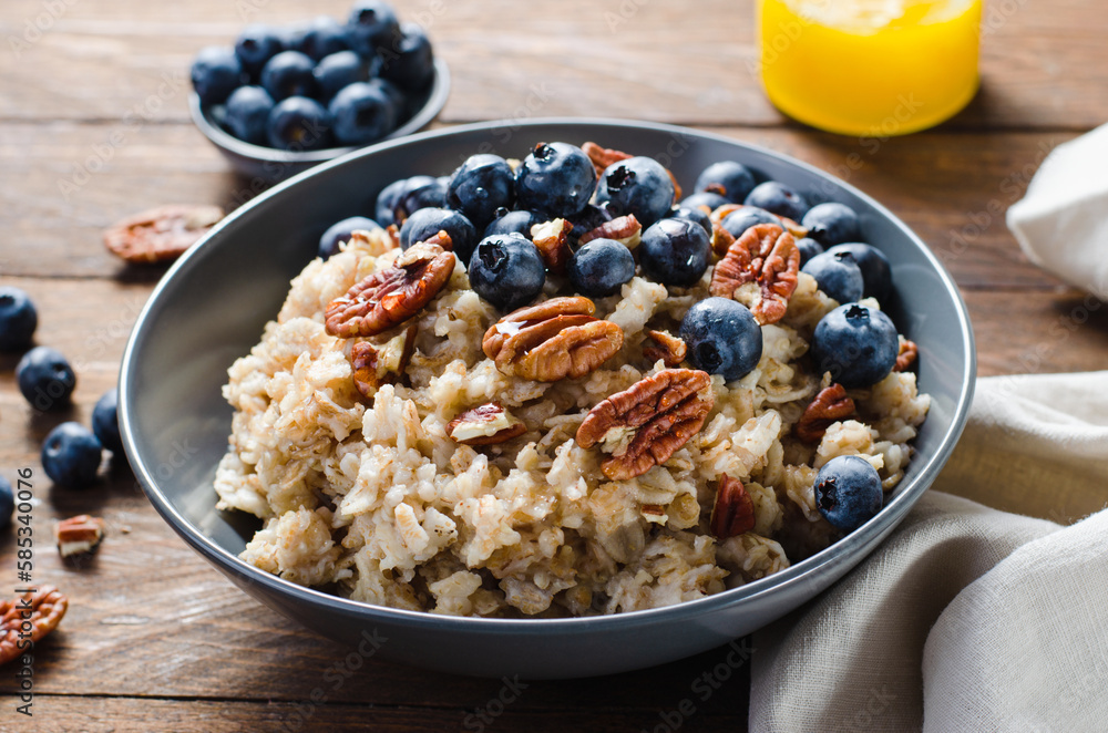 Oatmeal Bowl, Oat Porridge with Blueberry and Pecans in a Bowl on Rustic Background, Healthy Snack or Breakfast Oatmeal Bowl, Oat Porridge with Blueberry and Pecans in a Bowl on Rustic Background, Healthy Snack or Breakfast