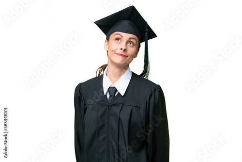 Young university graduate caucasian woman over isolated background and looking up