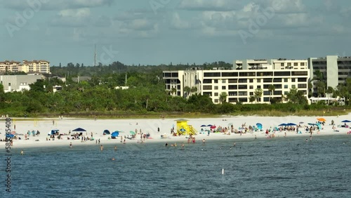 Wallpaper Mural Famous Siesta Key beach with soft white sand in Sarasota, USA. Many people enjoing vacation time bathing in warm gulf water and tanning under hot Florida sun Torontodigital.ca