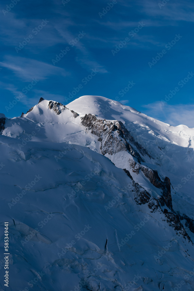 Sunlight on snowy mountain in Alps