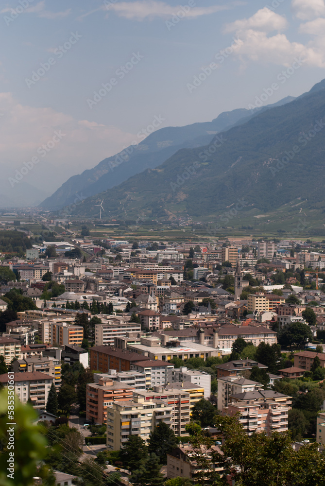 View on city in mountains in Alps in sunny day