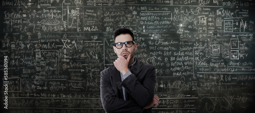 pensive man with math problems on the blackboard