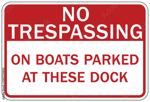 Dock warning sign and label no trespassing on boats parked at these dock