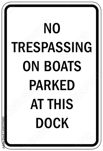 Dock warning sign and label no trespassing on boats parked at this dock