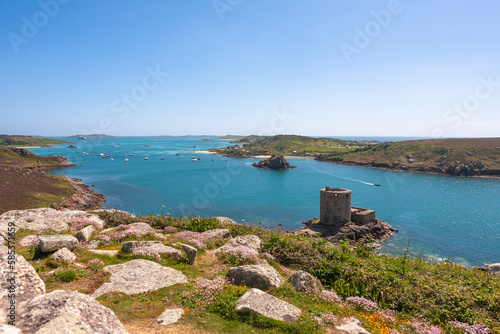 Tresco, Isles of Scilly, UK: view over New Grimsby Sound from Castle Down, with Cromwell's Castle below, Bryher on the right and St. Mary's beyond  photo