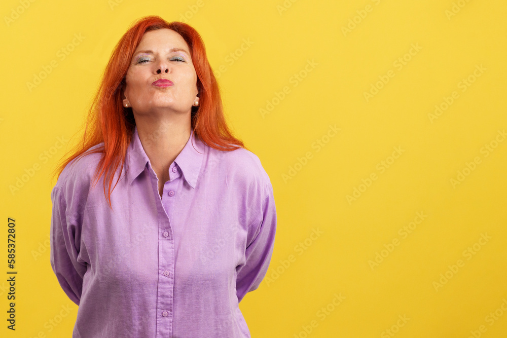 Redheaded mature and affectionate mother throwing a kiss Redheaded mature and affectionate mother throwing a kiss