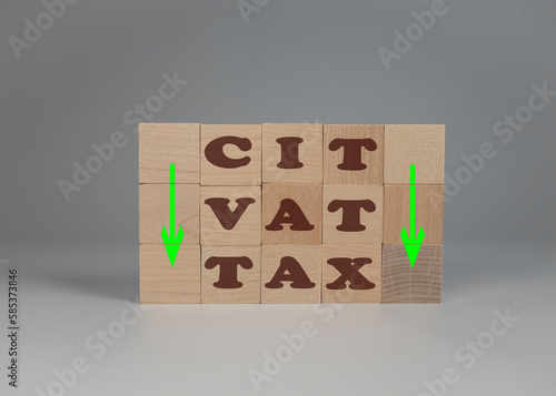 Wall Mural podatek VAT, CIT, Obniżenie podatku. Klocki z napisem TAX VAT CIT