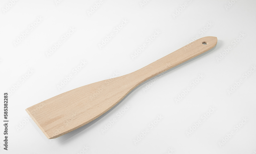 Wooden kitchen utensils. Large wooden spatula for turning steaks Wooden kitchen utensils. Large wooden spatula for turning steaks