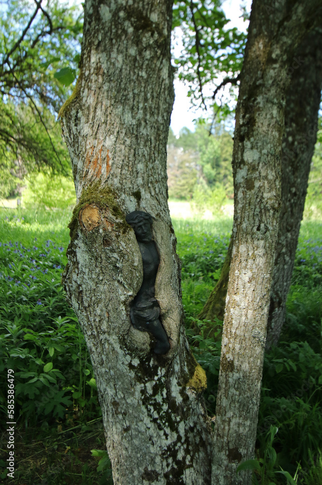 Crucifix in the wood, old cemetery in abandoned village Lupkow in Bieszczady Mountains, Poland Crucifix in the wood, old cemetery in abandoned village Lupkow in Bieszczady Mountains, Poland