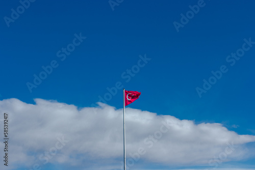 Turkish flag on sky background, red flag of Turkey