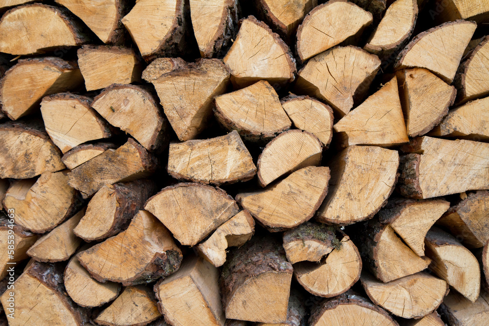 Pile of firewood stocked outdoors, in close up Pile of firewood stocked outdoors, in close up
