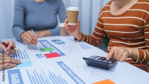 small business accounting team meeting three asian people with salary monthly charts data, basic business accounting and bookkeeping concept.