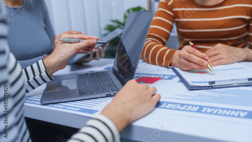 small business accounting team meeting three asian people with salary monthly charts data, basic business accounting and bookkeeping concept.