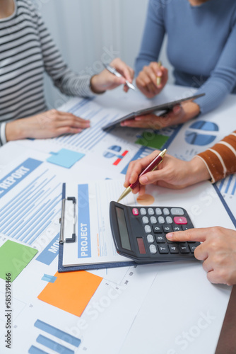 small business accounting team meeting three asian people with salary monthly charts data, basic business accounting and bookkeeping concept.