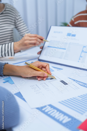 Obraz na plátně small business accounting team meeting three asian people with salary monthly charts data, basic business accounting and bookkeeping concept