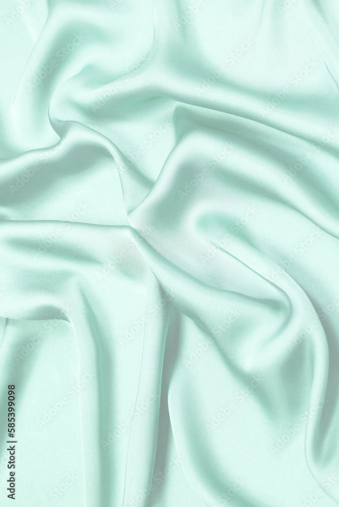 Obraz premium Blue silk or satin luxury fabric texture. Top view.