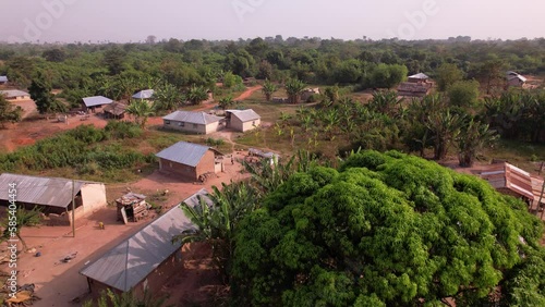 Drone shots and aerial view of dusty roads and dilapidated buildings in rural Africa.