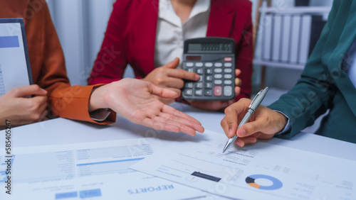 small business accounting team meeting three asian people with salary monthly charts data, basic business accounting and bookkeeping concept.