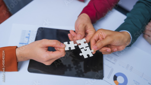 join hands jigsaw puzzle teamwork concept. small business accounting team meeting three asian people with salary monthly charts data, basic business accounting and bookkeeping concept.