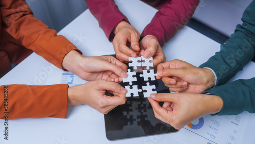join hands jigsaw puzzle teamwork concept. small business accounting team meeting three asian people with salary monthly charts data, basic business accounting and bookkeeping concept.