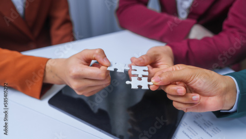 join hands jigsaw puzzle teamwork concept. small business accounting team meeting three asian people with salary monthly charts data, basic business accounting and bookkeeping concept.