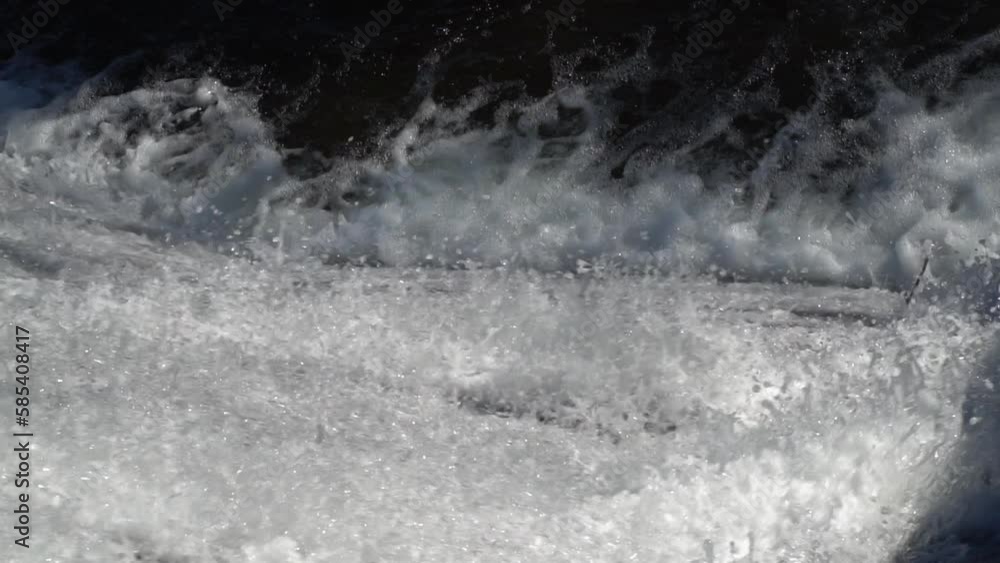 Waterfall water Cascading down the rock in slow motion Waterfall water Cascading down the rock in slow motion