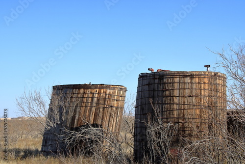 Old wood crude oil storage tanks