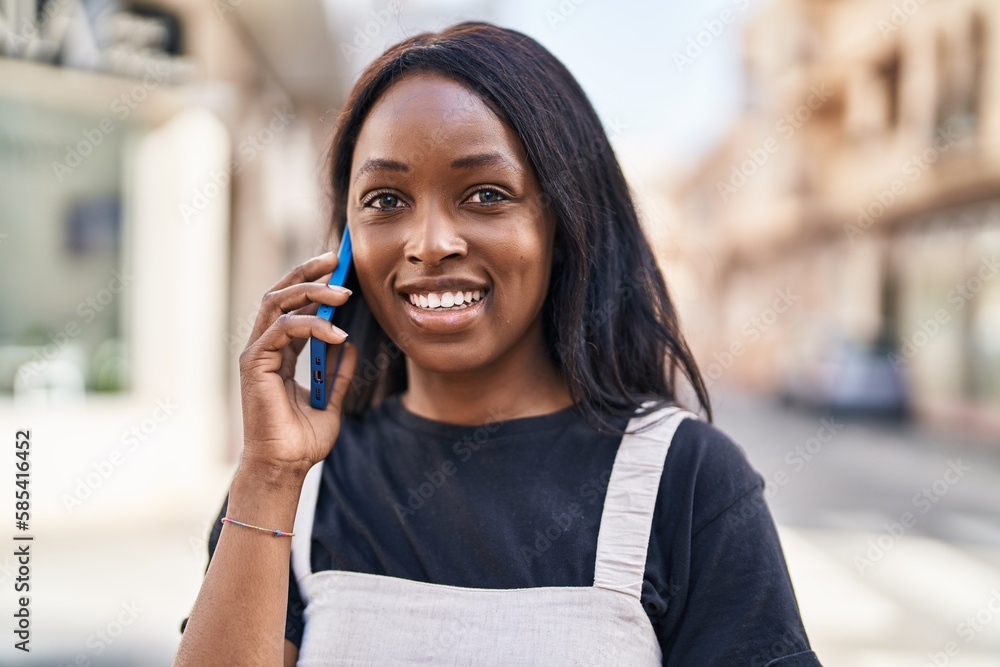 Young african american woman smiling confident talking on the smartphone at street Young african american woman smiling confident talking on the smartphone at street