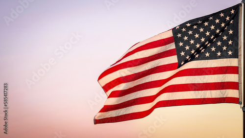 Memorial Day, Independence Day, 4th of July, Veterans Day, Labor Concept. American USA flag waving in the wind against sun flare overlay nature outdoor background, Slow Motion. Concept of Memorial Day