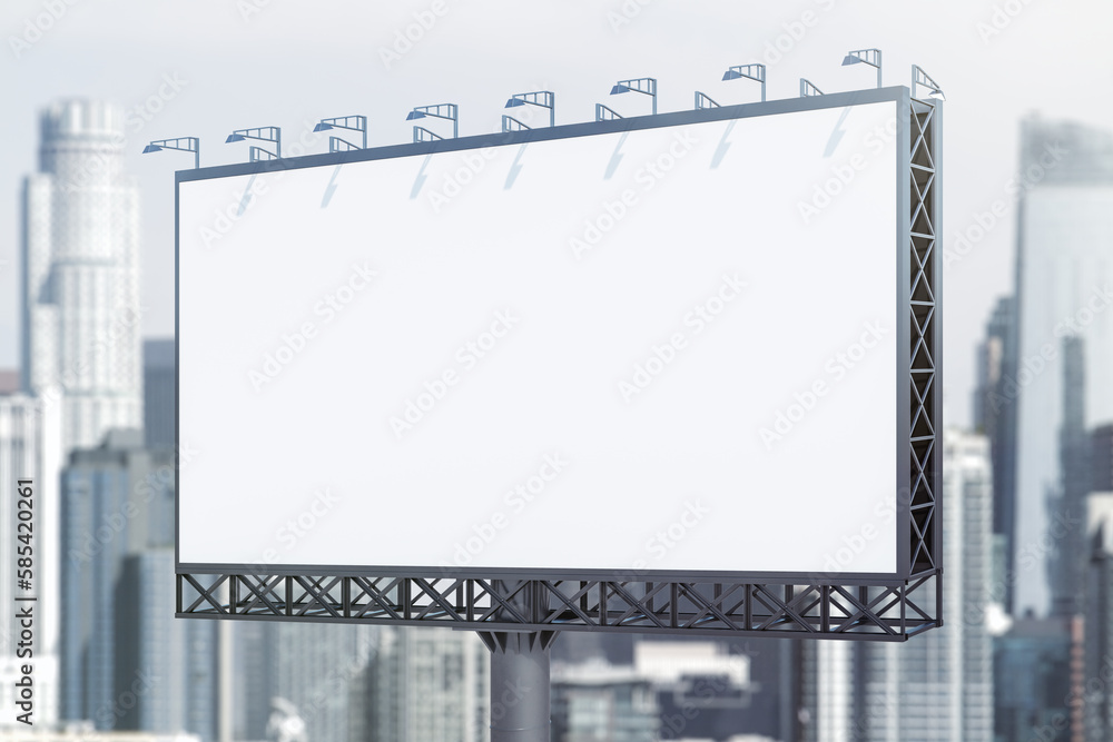 Fototapeta premium Blank white horizontal billboard on city buildings background at daytime, perspective view. Mockup, advertising concept