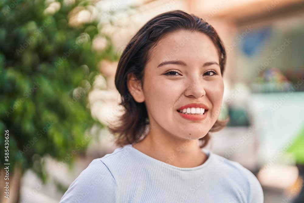 Young hispanic woman smiling confident standing at street Young hispanic woman smiling confident standing at street