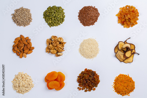 Fototapeta Naklejka Na Ścianę i Meble -  Healthy vegetarian food concept. Assortment of dried fruits, nuts and seeds on white background. Top view.