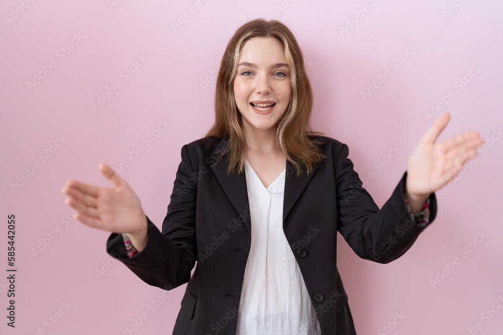 Young caucasian business woman wearing black jacket looking at the camera smiling with open arms for hug. cheerful expression embracing happiness. Young caucasian business woman wearing black jacket looking at the camera smiling with open arms for hug. cheerful expression embracing happiness.