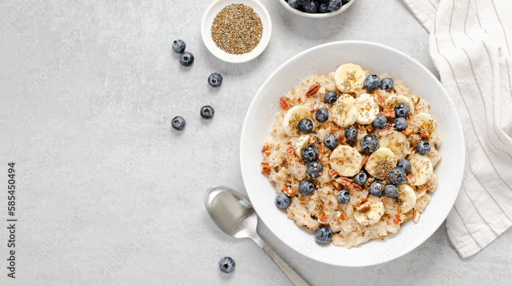 Oatmeal Bowl, Oat Porridge with Blueberry, Banana and Pecans in a Bowl on Bright Background, Healthy Snack or Breakfast Oatmeal Bowl, Oat Porridge with Blueberry, Banana and Pecans in a Bowl on Bright Background, Healthy Snack or Breakfast
