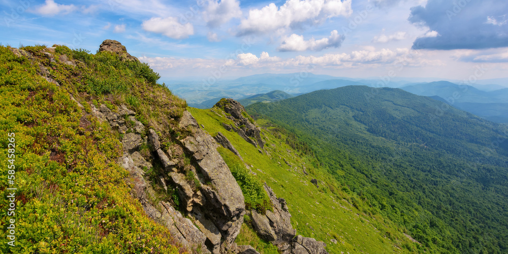 mountainous countryside scenery in summer. steep grassy slopes with stones. popular travel destination of ukrainian carpathians