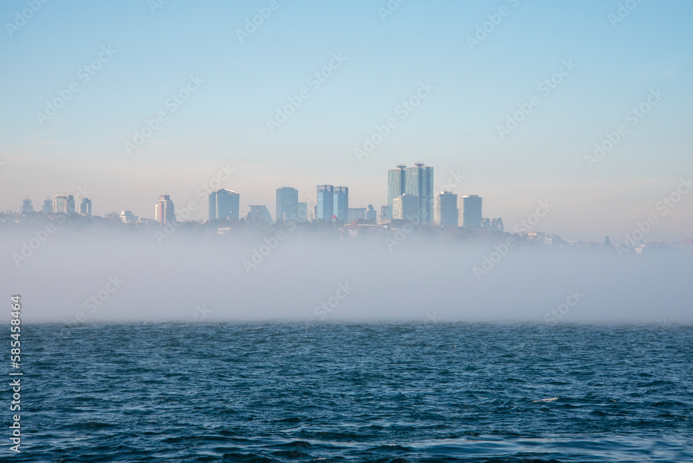 Fog over the Bosphorus Strait, the backdrop to high-rise buildings. Fog over the Bosphorus Strait, the backdrop to high-rise buildings.